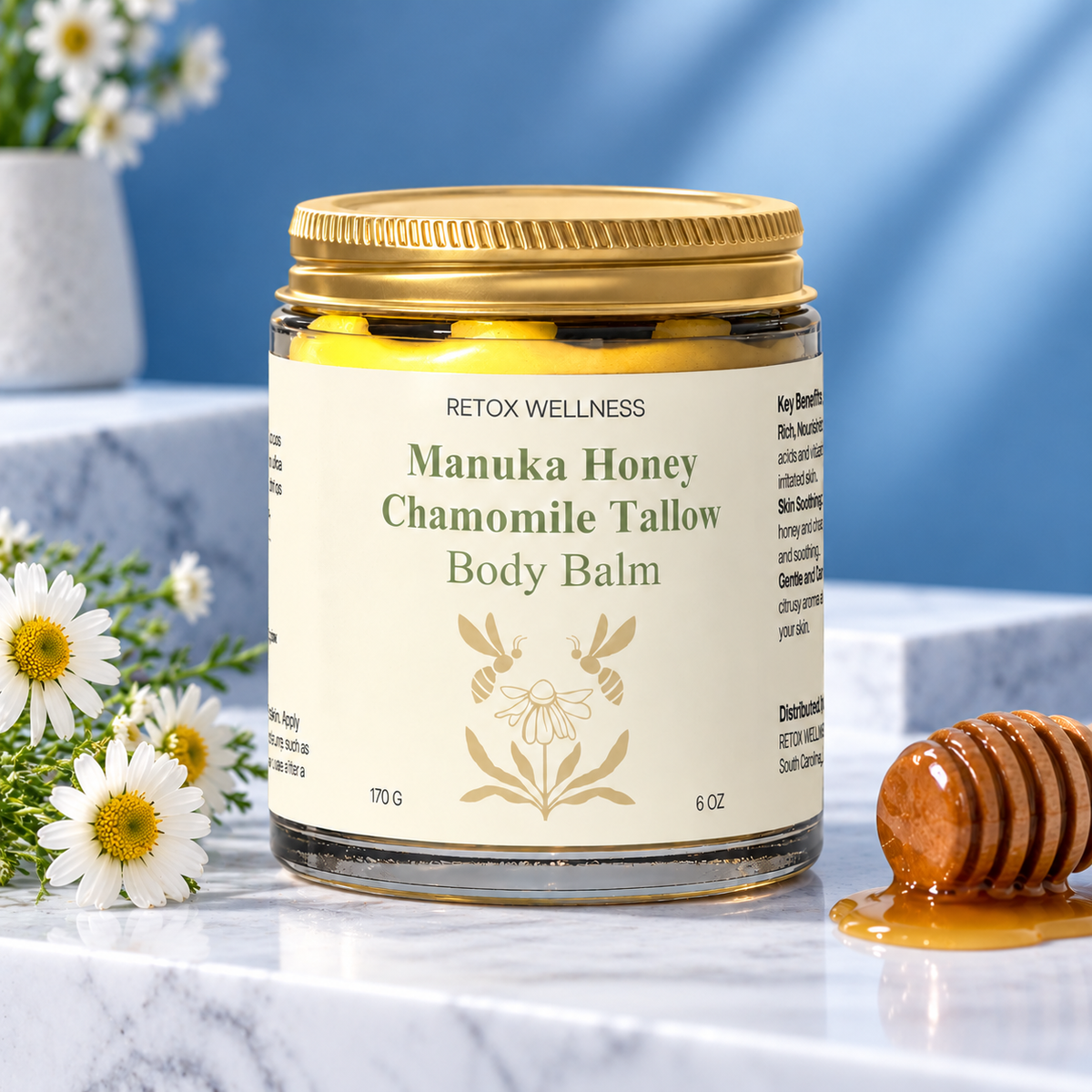 A jar of Rotox Wellness Manuka Honey Chamomile Tallow Body Balm sits on a white marble surface.
